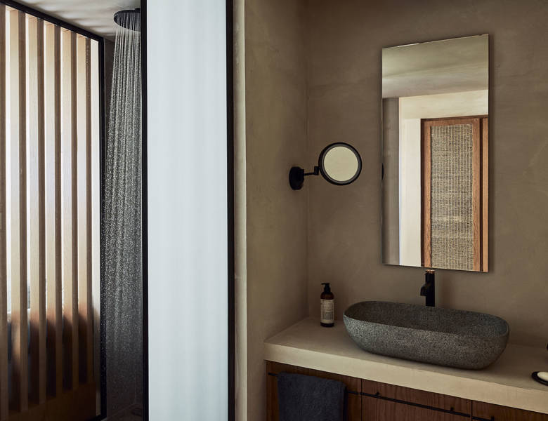 Zelia Resort Halkidiki Panorama Suites Sea View shower, washbasin, a big mirror and a small round one
