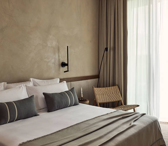 Zelia Resort Halkidiki Deluxe Double double bed and a chair
