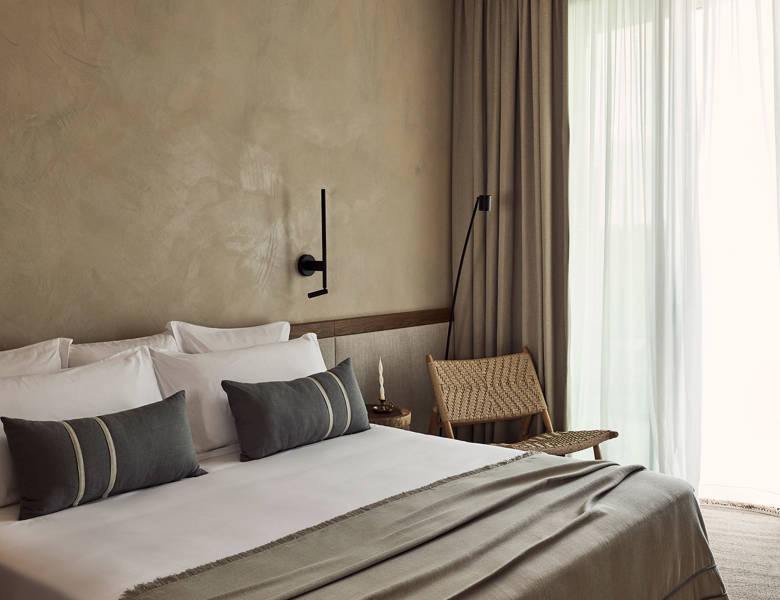 Zelia Resort Halkidiki Deluxe Double double bed and a chair
